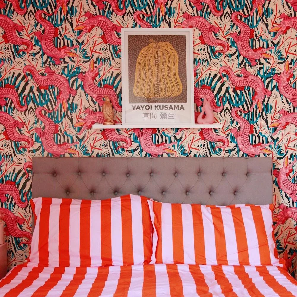 Colorful bedroom with alligator wallpaper