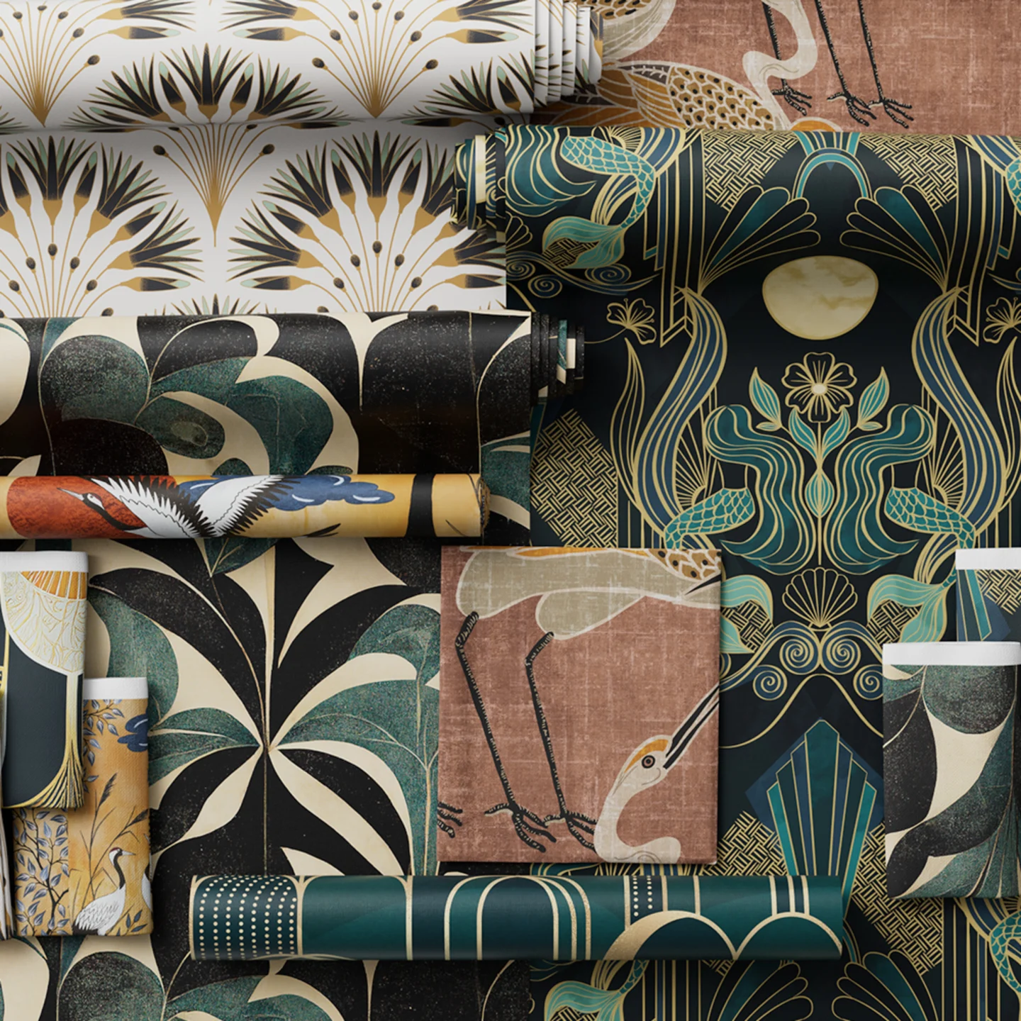 Wallpaper rolls and fabrics from the art deco collection styled together.