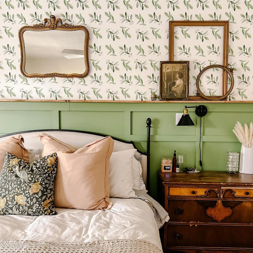 Watercolor foliage wallpaper in a bedroom.