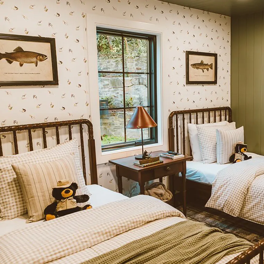 Cabin bedroom with fishing lure wallpaper.