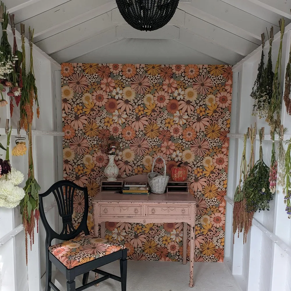 Flower drying shed with a floral wallpaper on the back wall by Spoonflower Artist garabateo.
