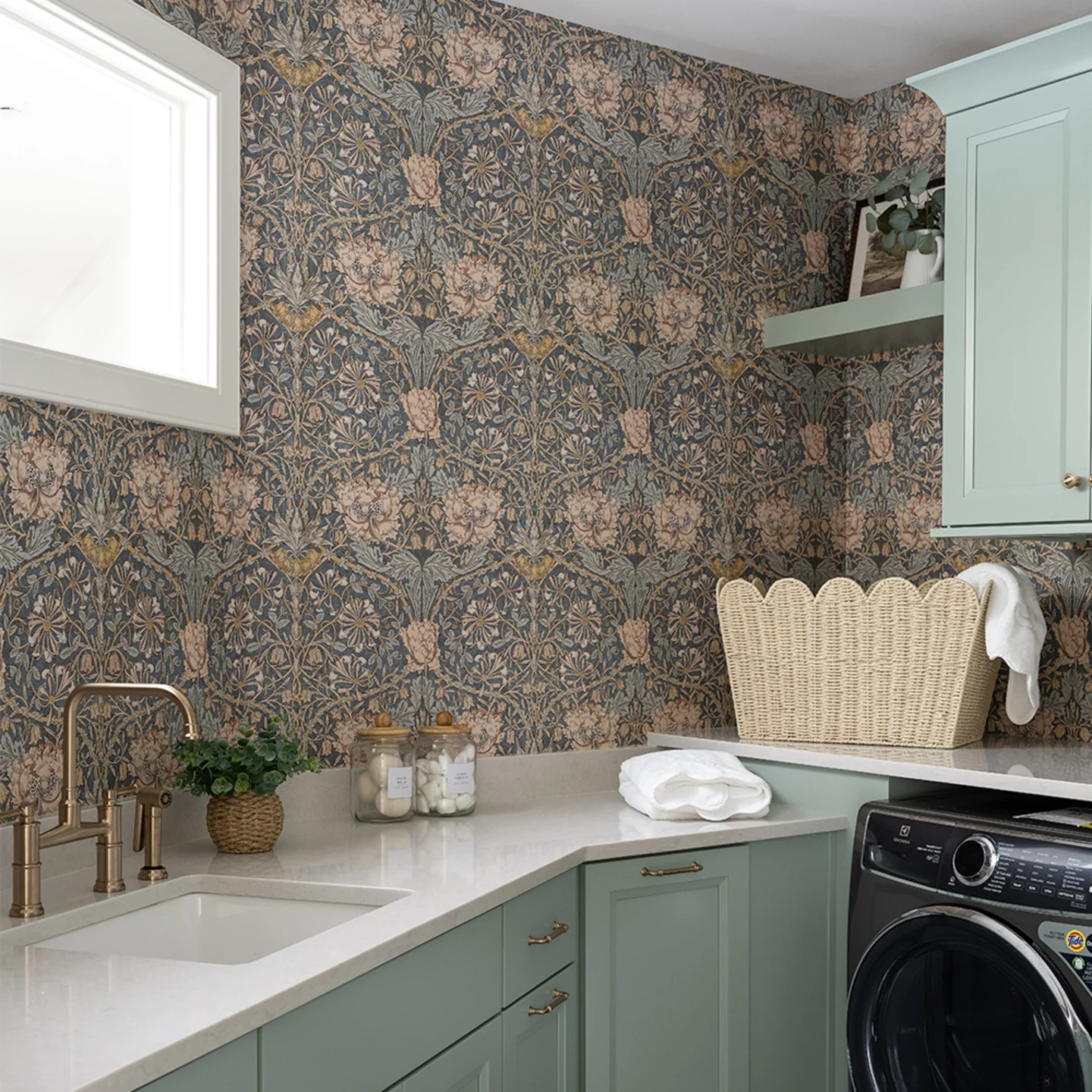 Laundry room with William Morris Honeysuckle wallpaper.