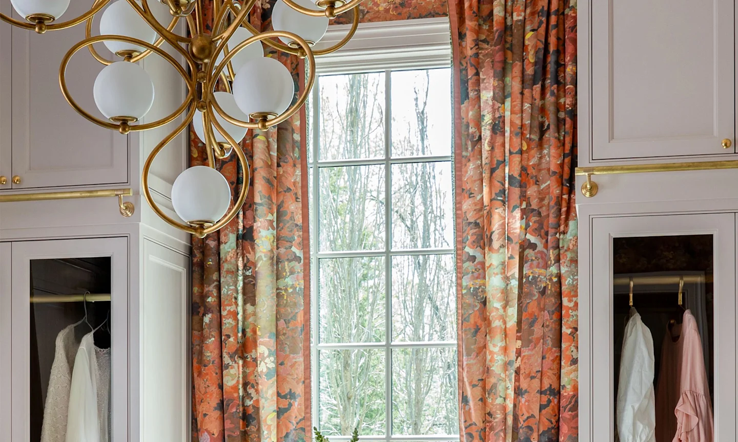 Elegant warm-toned curtains hanging in a dressing room