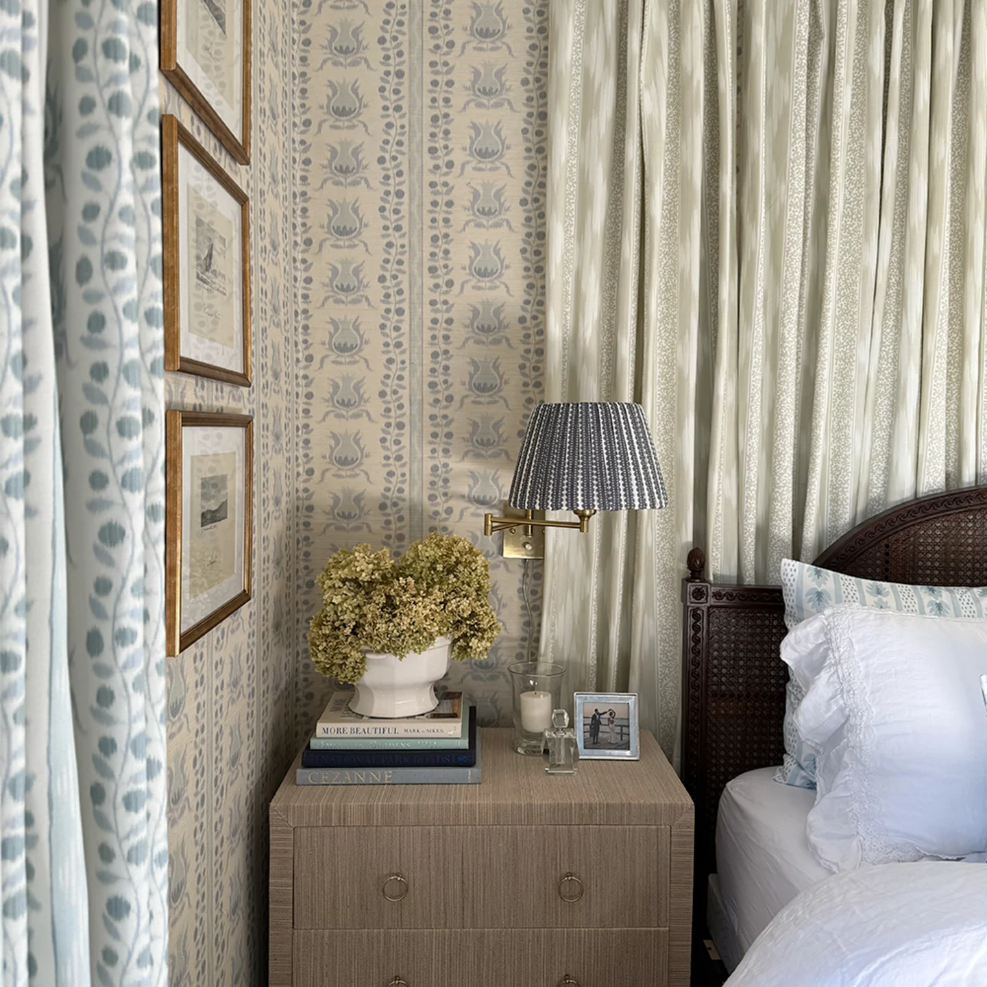 Bedroom with ikat pomegranates wallpaper, matching curtains, bedding and fabric lampshade.