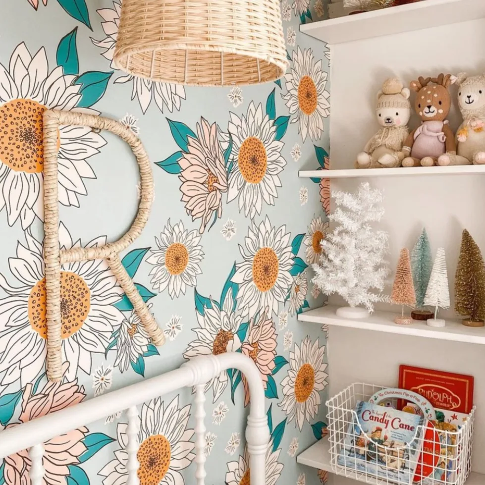 A kids room with sweet floral wallpaper