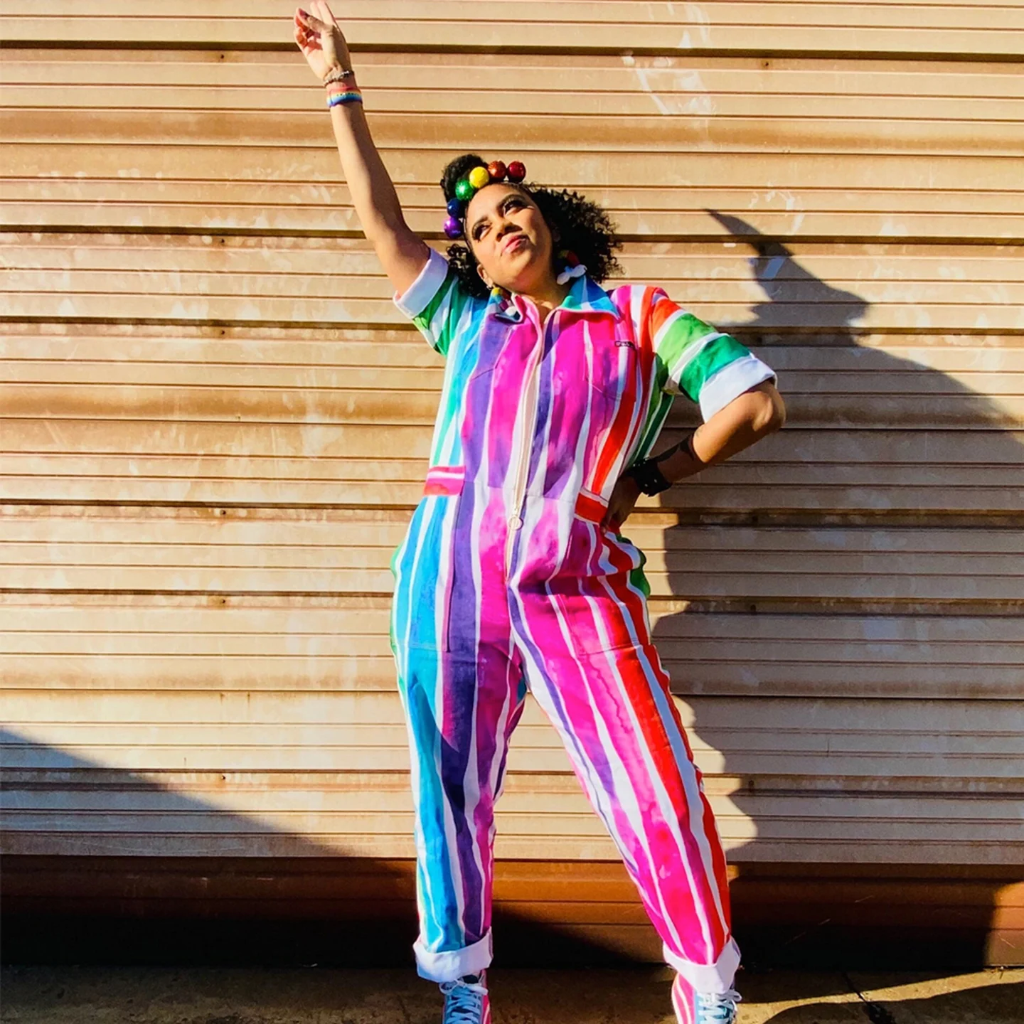 Woman wearing rainbow jumpsuit