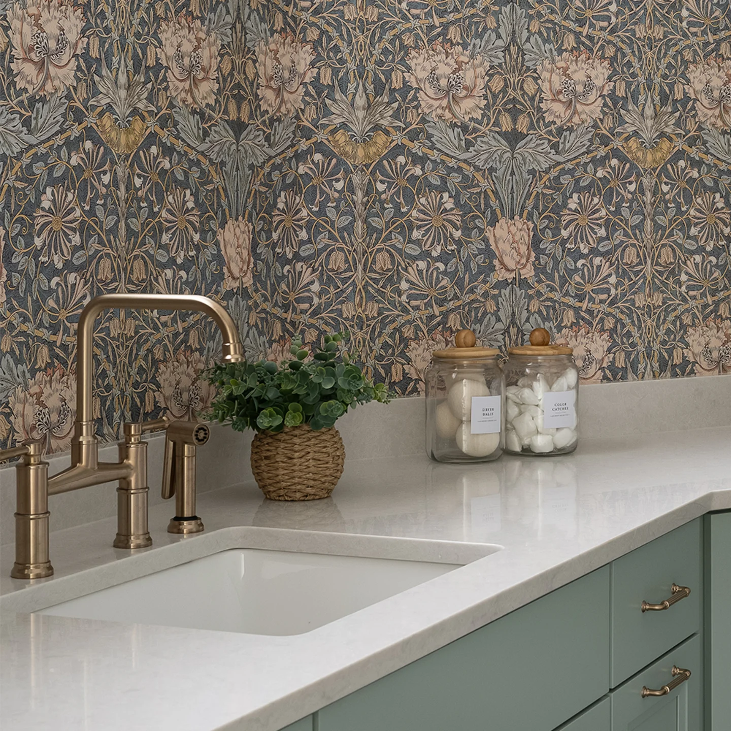 Kitchen with william morris honeysucke wallpaper.