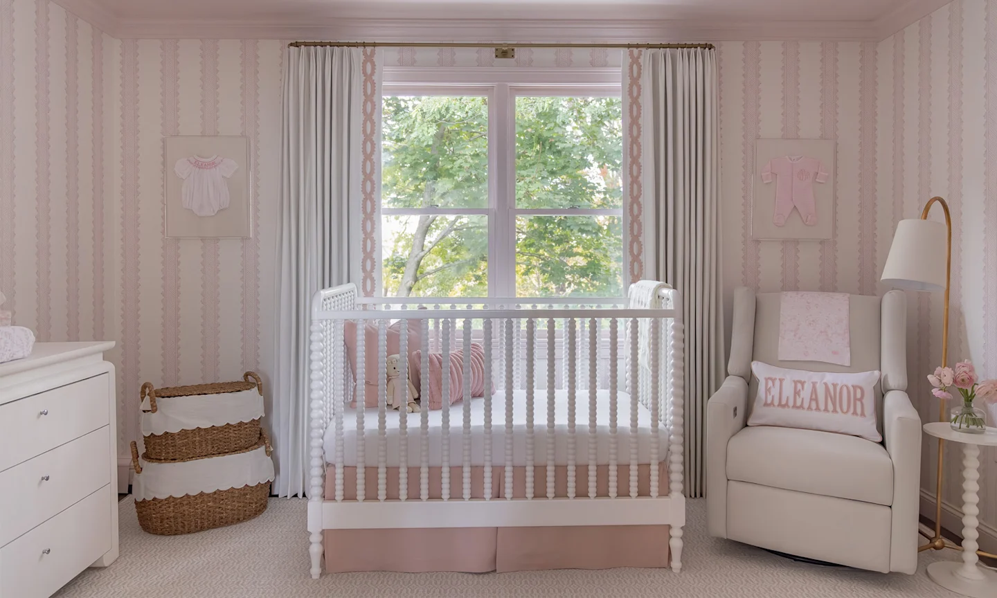 Baby sitting in a swan themed nursery