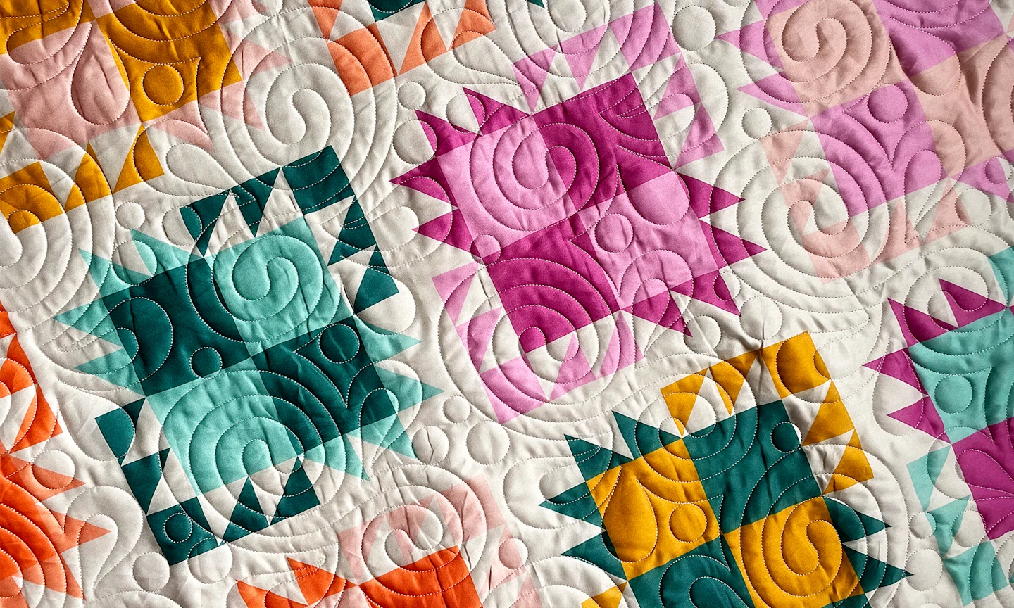 Colorful modern quilt with bright colors printed with Spoonflower fabric