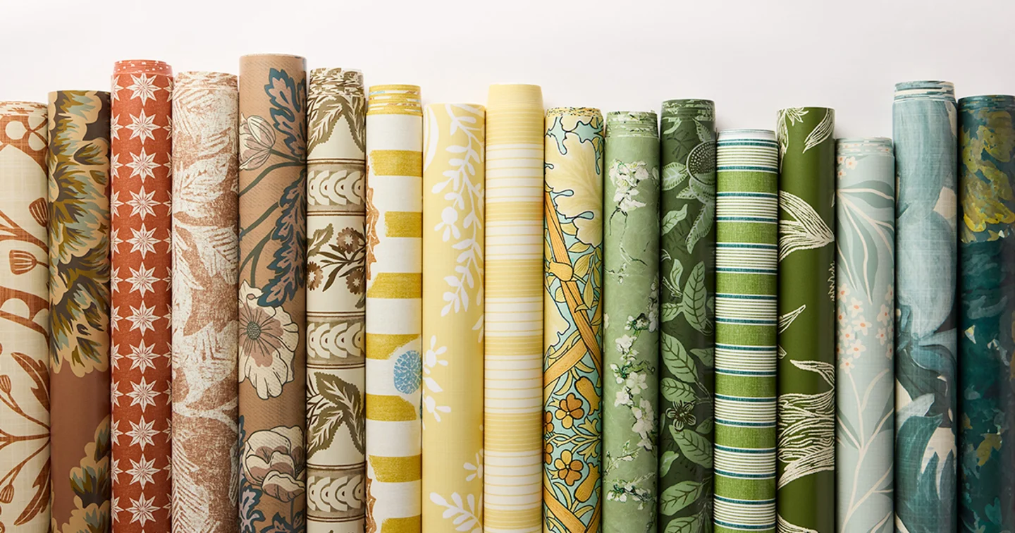 Rolls of wallpaper in trending interior colors.
