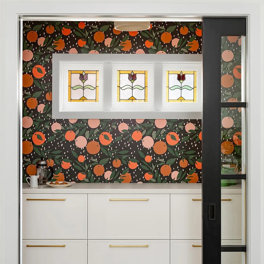 Tangerine wallpaper in a pantry.