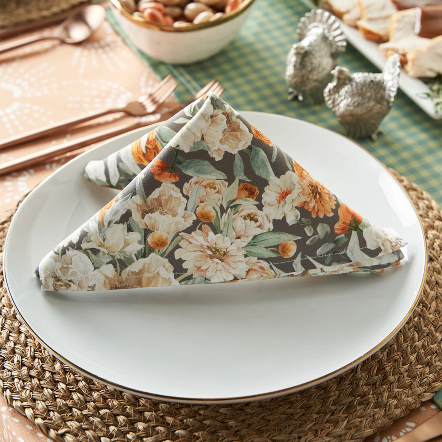 Folded farmhouse floral pattern dinner napkin on dining table