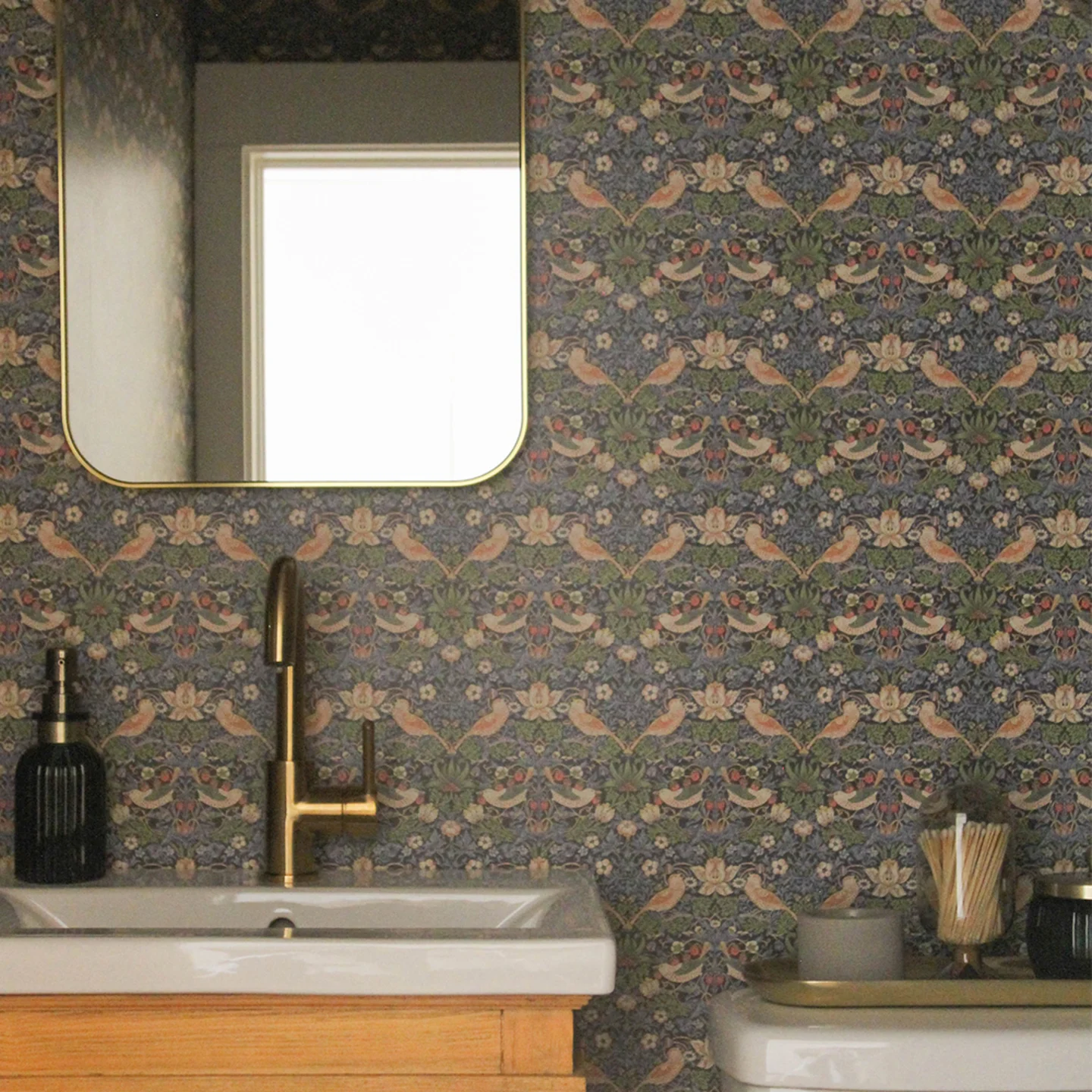 Bathroom with William Morris inspired wallpaper.