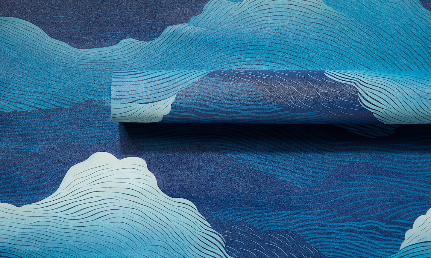 Blue abstract wave design on vinyl wallpaper roll.