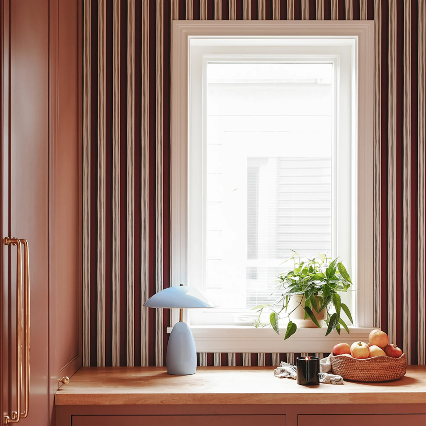 Kitchen with faux tile design wallpaper.