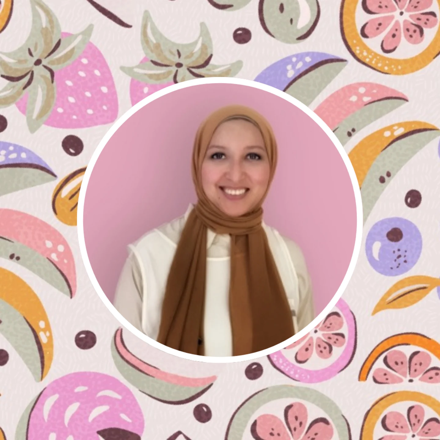 Mona Ahmed in front of her charcuterie board fruits design.