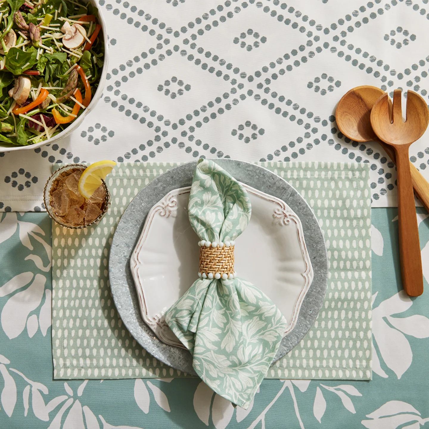 Farmhouse table linens featuring soft mint and sage green designs.